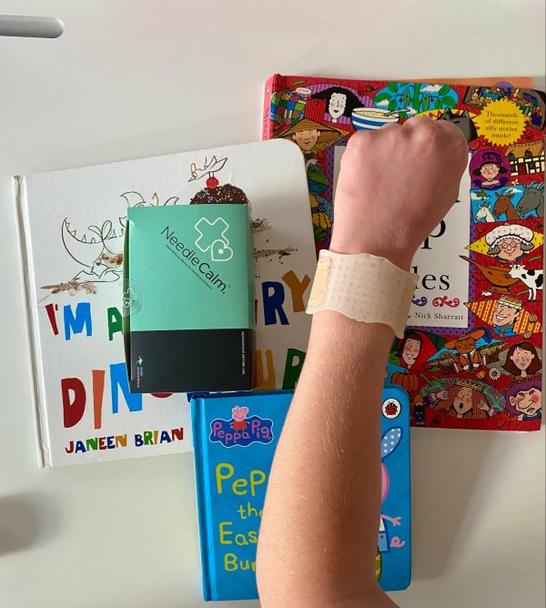 NeedleCalm needle desensitising adhesive pad on a child's arm.